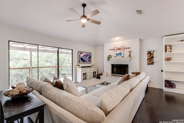 9811 Rebel Queen, San Antonio, TX 78255 - living room with ceiling fan, dark wood-type flooring, lofted ceiling, a fireplace, and baseboards