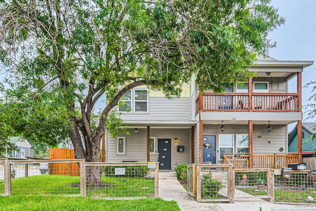1130 Wyoming St Unit B, San Antonio, TX 78203 - view of front of property featuring a balcony, a gate, and covered porch