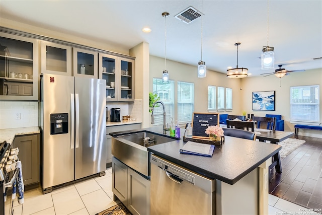 1130 Wyoming St Unit B, San Antonio, TX 78203 - kitchen with stainless steel appliances, plenty of natural light, open floor plan, decorative backsplash, and recessed lighting
