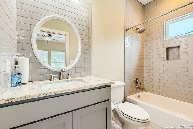 1130 Wyoming St Unit B, San Antonio, TX 78203 - full bathroom featuring a ceiling fan, decorative backsplash, vanity, toilet, and shower / bathtub combination