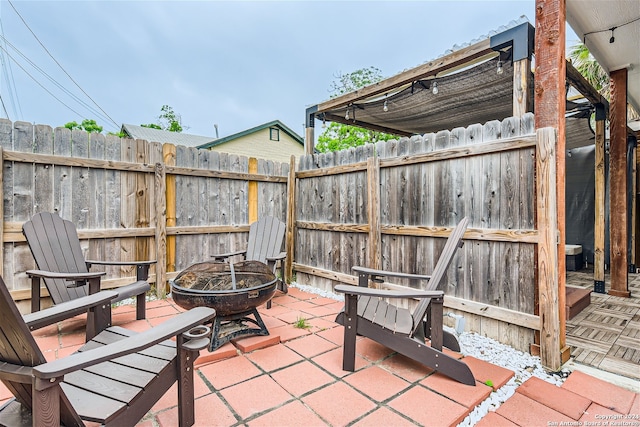 1130 Wyoming St Unit B, San Antonio, TX 78203 - view of patio featuring an outdoor fire pit and fence