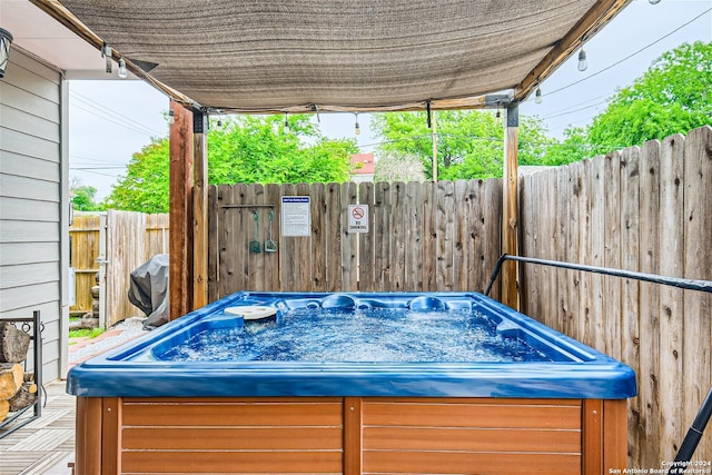 1130 Wyoming St Unit B, San Antonio, TX 78203 - view of patio featuring a hot tub and fence
