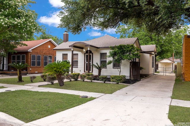 1717 W Summit Ave, San Antonio, TX 78201 - bungalow featuring a gate, driveway, a chimney, and roof with shingles