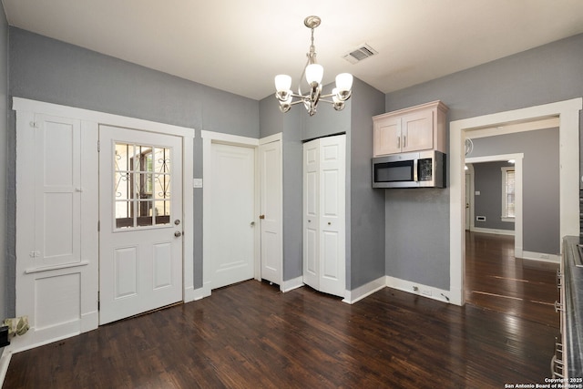 1717 W Summit Ave, San Antonio, TX 78201 - entryway with a chandelier, dark wood-style flooring, and baseboards