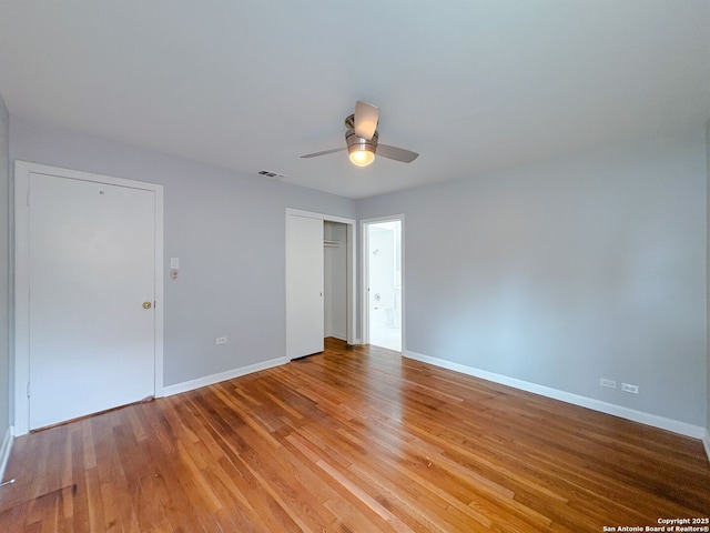 155 Eland, San Antonio, TX 78213 - unfurnished bedroom featuring baseboards, light wood finished floors, ceiling fan, and a closet