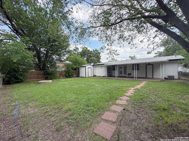 155 Eland, San Antonio, TX 78213 - view of yard with french doors, a storage shed, central air condition unit, an outbuilding, and a patio area
