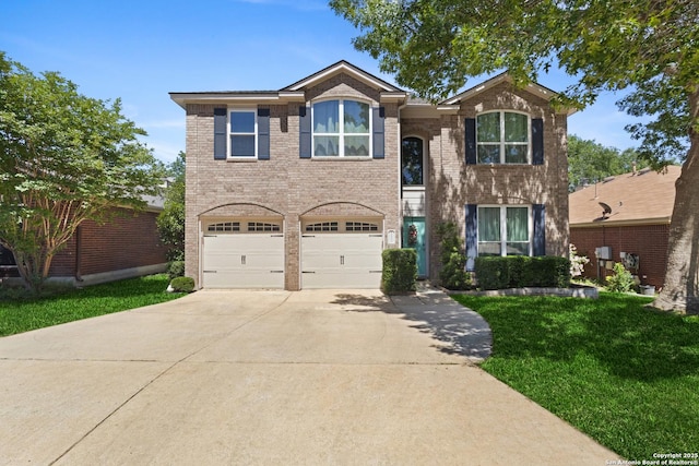 21503 Rio Comal, San Antonio, TX 78259 - traditional-style house featuring driveway, a garage, a front lawn, and brick siding