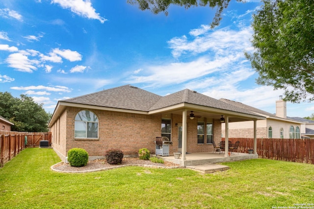 3136 San Miguel, New Braunfels, TX 78132 - rear view of property with ceiling fan, brick siding, a shingled roof, and a patio