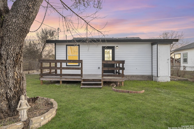 1527 W French Pl, San Antonio, TX 78201 - back of property at dusk featuring a deck