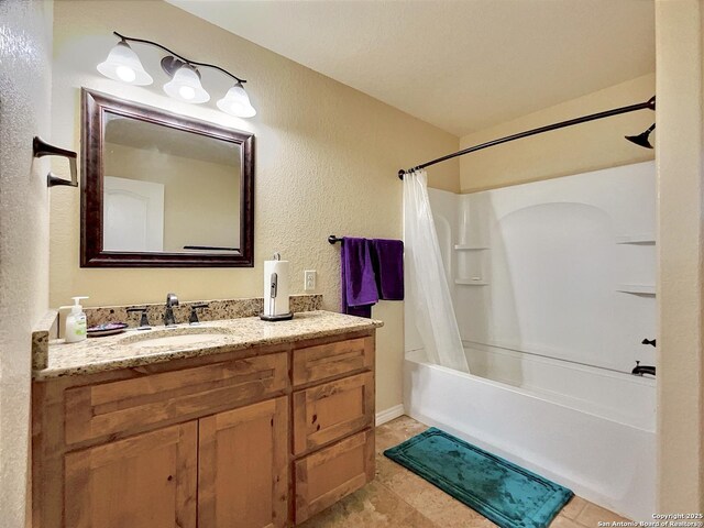 3389 Fm 888, Beeville, TX 78102 - bathroom with a textured wall, shower / bathtub combination with curtain, and vanity