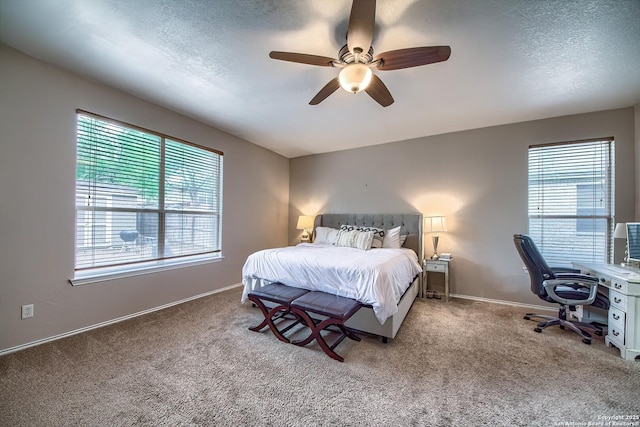 1227 Sun Spg, San Antonio, TX 78245 - carpeted bedroom featuring ceiling fan, a desk, baseboards, and a textured ceiling
