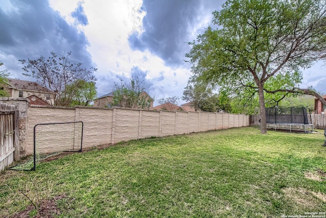 1227 Sun Spg, San Antonio, TX 78245 - view of yard with a trampoline