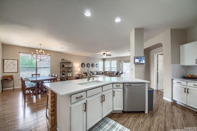 1227 Sun Spg, San Antonio, TX 78245 - kitchen featuring a sink, dishwasher, wood finished floors, light countertops, and healthy amount of natural light