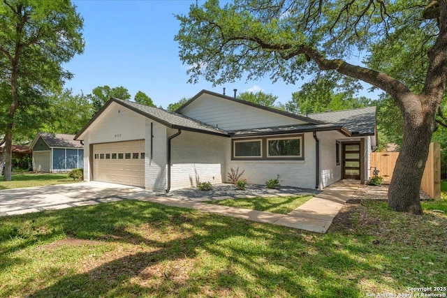single story home with an attached garage, driveway, brick siding, and a shingled roof