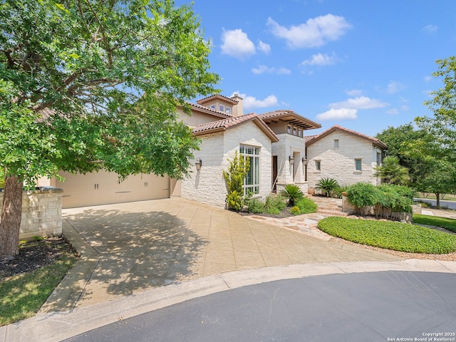 7 Naples Ct, San Antonio, TX 78257 - mediterranean / spanish house featuring a tile roof, stone siding, driveway, a garage, and stucco siding