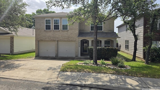 9406 Vallecito Pass, San Antonio, TX 78250 - view of front facade featuring driveway, a garage, and brick siding