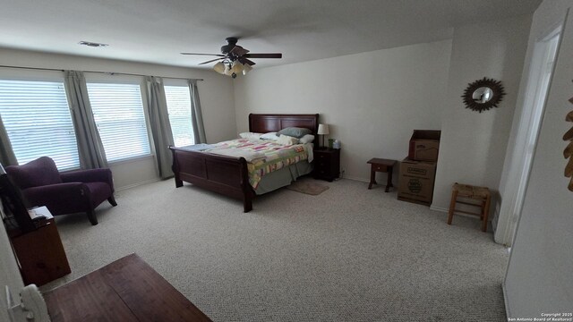9406 Vallecito Pass, San Antonio, TX 78250 - carpeted bedroom featuring baseboards and a ceiling fan