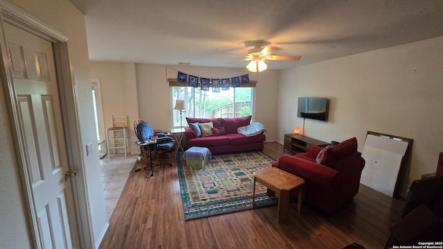9406 Vallecito Pass, San Antonio, TX 78250 - living area with wood finished floors and a ceiling fan