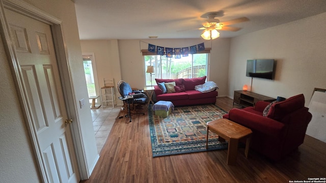 9406 Vallecito Pass, San Antonio, TX 78250 - living room with wood finished floors, a ceiling fan, and baseboards