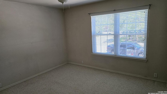 9406 Vallecito Pass, San Antonio, TX 78250 - carpeted spare room featuring baseboards