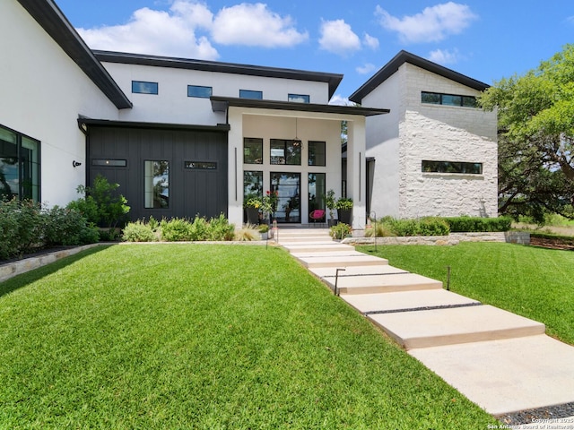 756 Annabelle Ave, Bulverde, TX 78163 - contemporary home with a front yard, stucco siding, board and batten siding, and stone siding