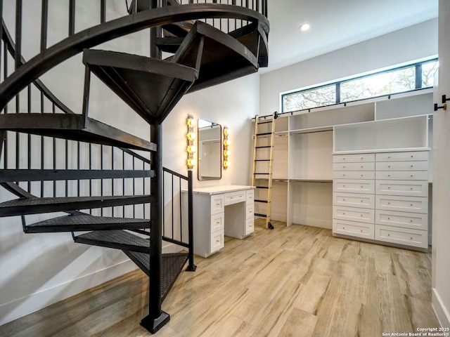 756 Annabelle Ave, Bulverde, TX 78163 - stairs featuring wood finished floors, plenty of natural light, recessed lighting, a barn door, and baseboards