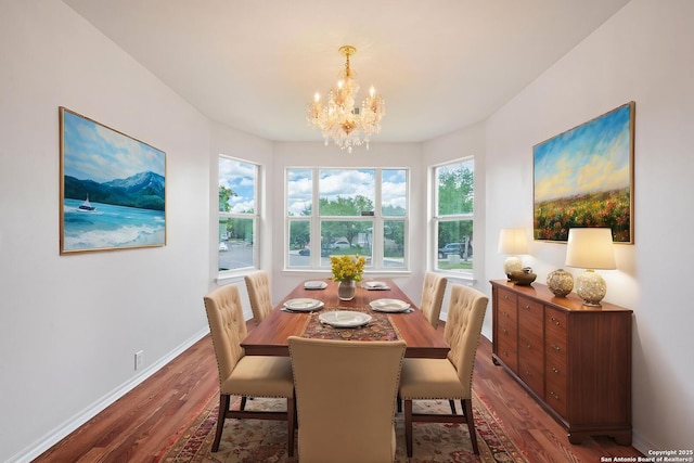 15603 Hastings Park, Selma, TX 78154 - dining room with wood finished floors, a chandelier, and baseboards