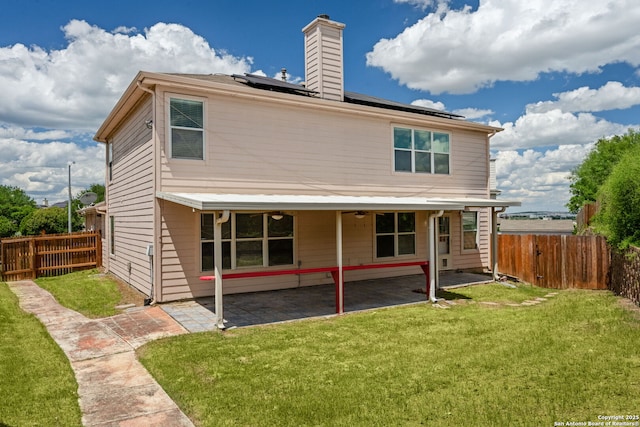 15603 Hastings Park, Selma, TX 78154 - rear view of property with roof mounted solar panels, a patio, and a chimney