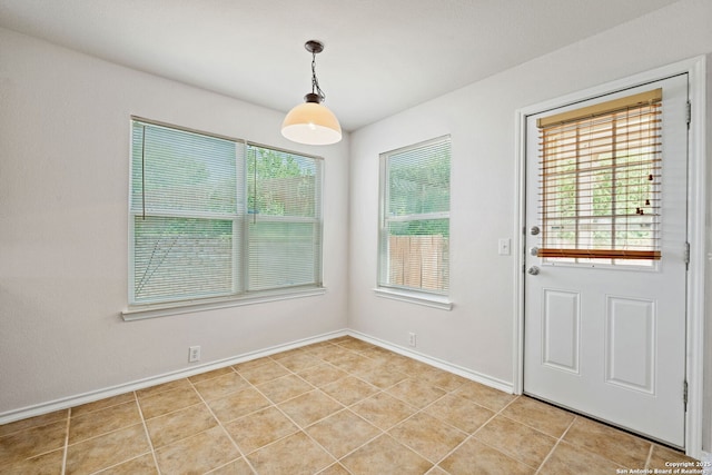 15603 Hastings Park, Selma, TX 78154 - unfurnished dining area featuring healthy amount of natural light, baseboards, and light tile patterned floors