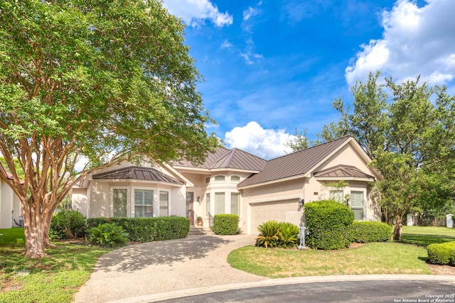 2 Worthsham, San Antonio, TX 78257 - view of front of house featuring a standing seam roof, stucco siding, a garage, metal roof, and a front yard