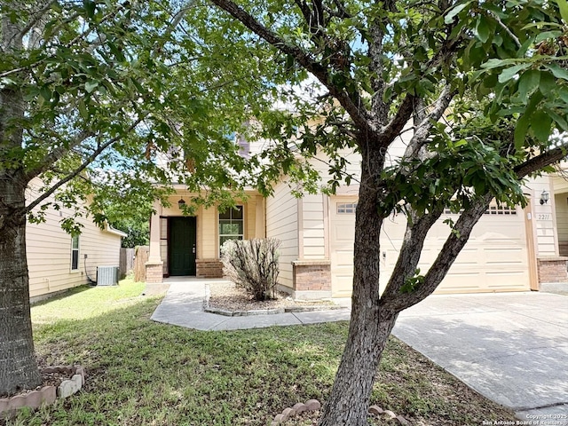 2211 Mission Verde, San Antonio, TX 78223 - view of property hidden behind natural elements featuring concrete driveway, brick siding, a front lawn, central AC, and a garage