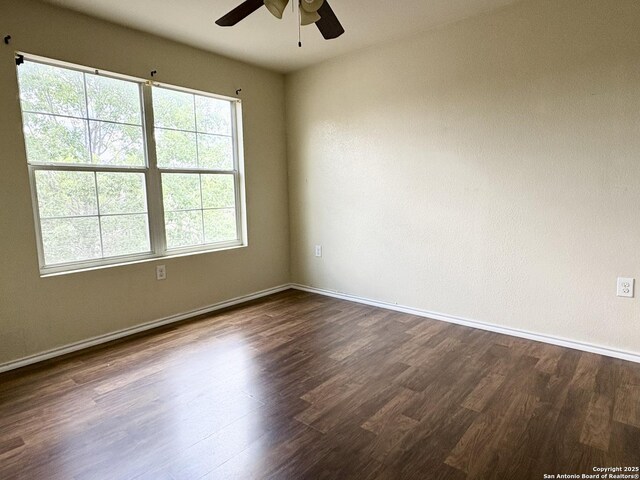 2211 Mission Verde, San Antonio, TX 78223 - unfurnished room featuring ceiling fan, dark wood-type flooring, and baseboards