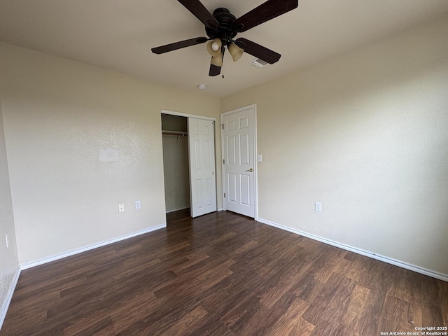 2211 Mission Verde, San Antonio, TX 78223 - unfurnished bedroom with baseboards, dark wood-style floors, and a closet