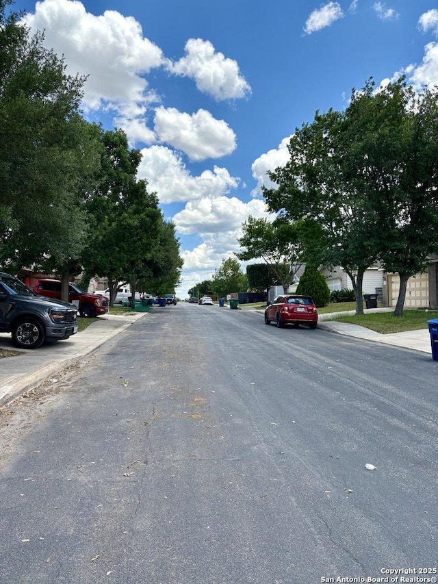 2211 Mission Verde, San Antonio, TX 78223 - view of asphalt street featuring curbs and sidewalks