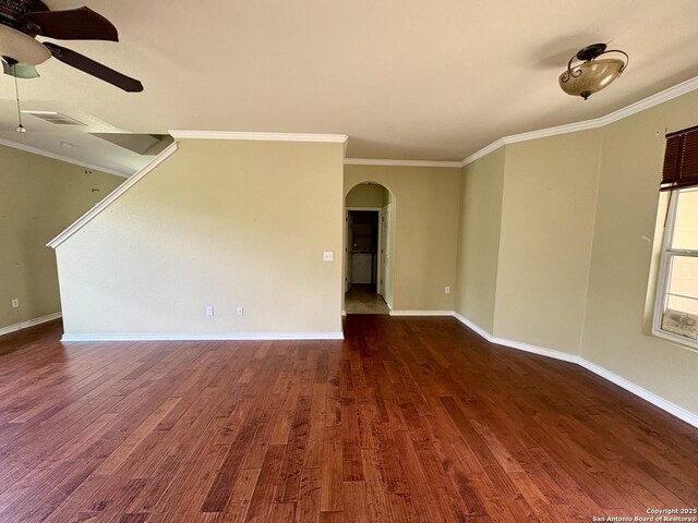 2211 Mission Verde, San Antonio, TX 78223 - spare room with arched walkways, ceiling fan, dark wood finished floors, ornamental molding, and baseboards