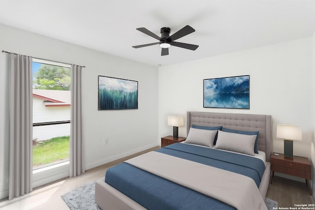 7621 Strolling Ln, Live Oak, TX 78233 - bedroom with baseboards, a ceiling fan, and wood finished floors