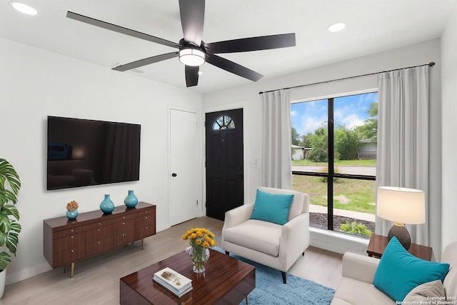 7621 Strolling Ln, Live Oak, TX 78233 - living room with light wood-style floors, a ceiling fan, and recessed lighting