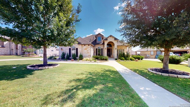 2542 Varrelmann, New Braunfels, TX 78132 - view of front of home featuring a front yard and stone siding