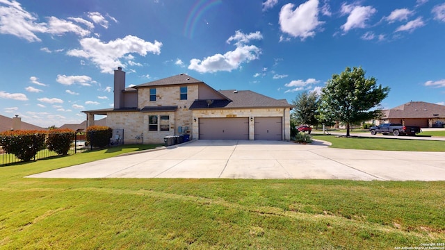 2542 Varrelmann, New Braunfels, TX 78132 - back of property with driveway, a chimney, an attached garage, and stone siding