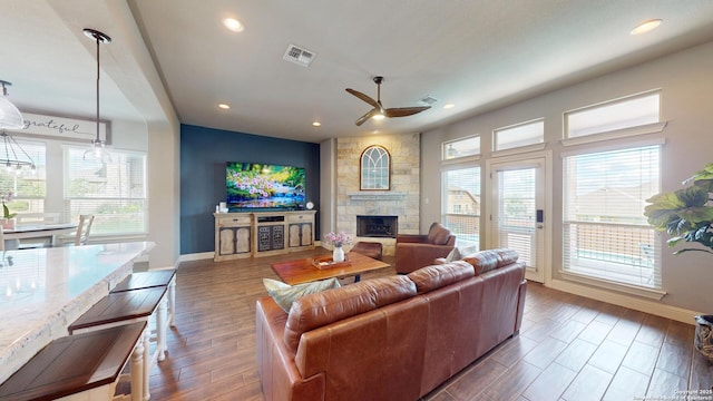 2542 Varrelmann, New Braunfels, TX 78132 - living room with a ceiling fan, healthy amount of natural light, a fireplace, baseboards, and recessed lighting
