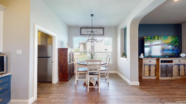 2542 Varrelmann, New Braunfels, TX 78132 - dining space with a chandelier, wood finished floors, and baseboards