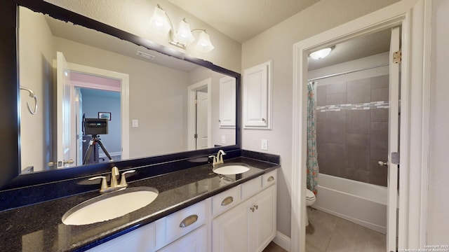 2542 Varrelmann, New Braunfels, TX 78132 - full bathroom with toilet, tile patterned floors, double vanity, and shower / bath combination with curtain