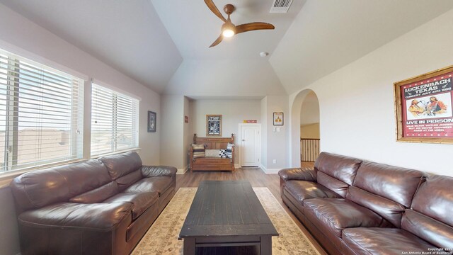 2542 Varrelmann, New Braunfels, TX 78132 - living room with arched walkways, a ceiling fan, wood finished floors, lofted ceiling, and baseboards