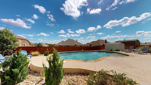 2542 Varrelmann, New Braunfels, TX 78132 - view of swimming pool featuring a patio area, a fenced backyard, a storage unit, and an outdoor structure