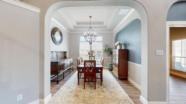 2542 Varrelmann, New Braunfels, TX 78132 - dining area featuring plenty of natural light, a chandelier, wood finished floors, and a tray ceiling