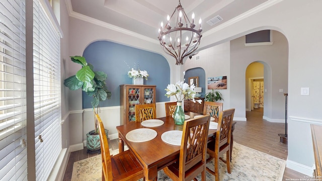 2542 Varrelmann, New Braunfels, TX 78132 - dining room with a chandelier, wood finished floors, arched walkways, ornamental molding, and baseboards