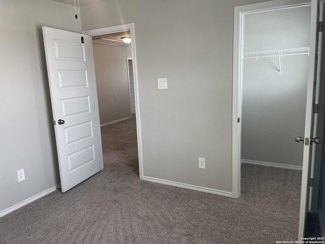 1138 Gracie Way, New Braunfels, TX 78130 - unfurnished bedroom featuring carpet, a closet, baseboards, and attic access
