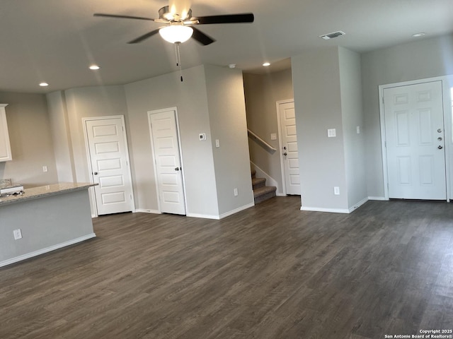 1138 Gracie Way, New Braunfels, TX 78130 - unfurnished living room featuring ceiling fan, recessed lighting, dark wood finished floors, stairs, and baseboards