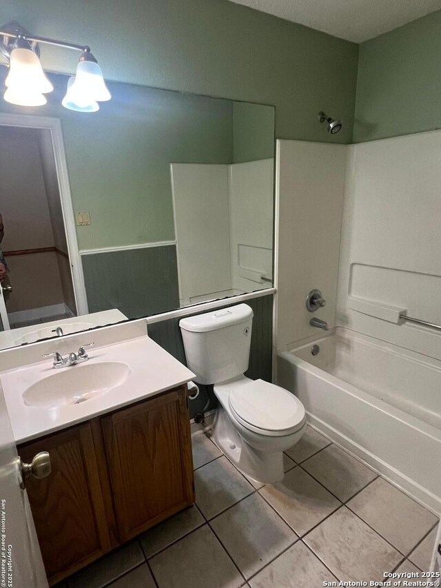 15558 Knollmeadow, San Antonio, TX 78247 - bathroom with tile patterned flooring, vanity, toilet, and tub / shower combination