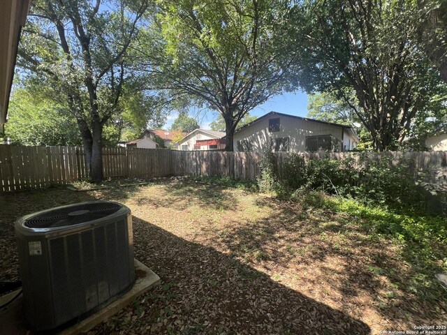 15558 Knollmeadow, San Antonio, TX 78247 - fenced backyard featuring central air condition unit